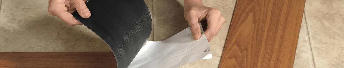 A professional installing vinyl flooring in Phoenix, AZ